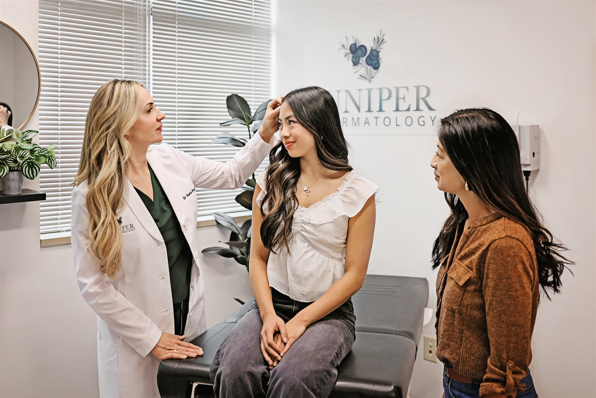 Dermatologist consulting with a patient about hair loss at Juniper Dermatology