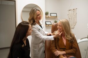 Dermatologist in Bend, Oregon examining a patient's face