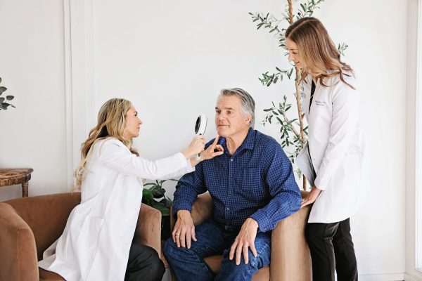 Juniper-Dermatology-Melasma-Patient-3-Bend Providers consulting with male patient for melasma treatment in Bend, OR
